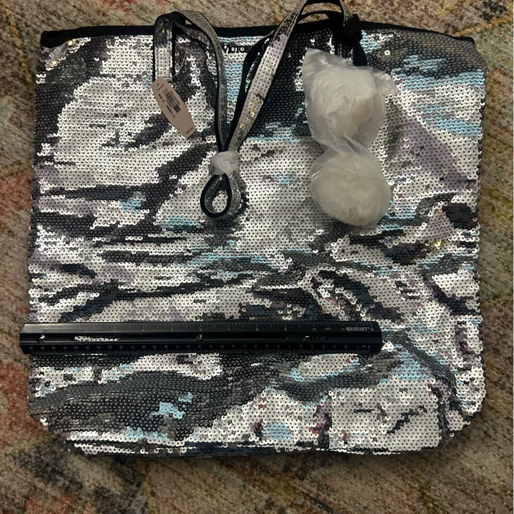 NWT - Silver sequin Victoria’s Secret bag.￼16 wide x 3.5 bottom.